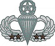 U.S. Army master
parachutist's badge with bronze star devices signifying four
airborne assaults in combat